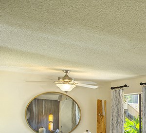 Woodbridge Apartments: Plan 2B Living Area a living room with couches and chairs and a table